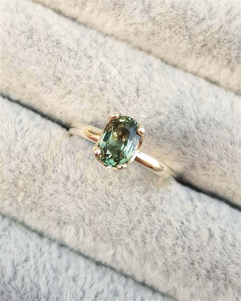 Green Sapphire Oval Solitaire Engagement Ring • Clifton Rocks