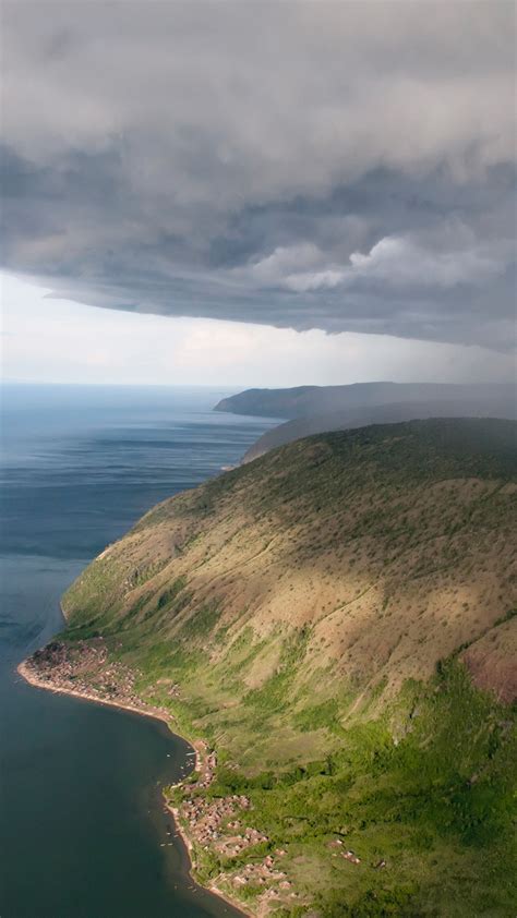 A thunderstorm moves over the eastern shore of Lake Albert, Albertine Rift, Uganda | Windows ...