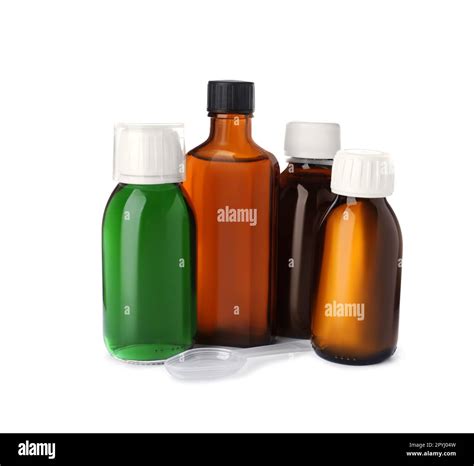 Bottles of syrups with plastic spoon on white background. Cough and ...