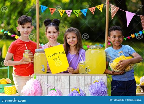 Cute Little Children at Lemonade Stand. Summer Refreshing Natural Drink ...