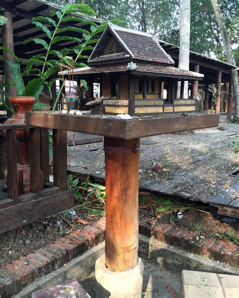 T’in Spirit Gates: Wooden Portal Guardians of Lao Mountain Villages