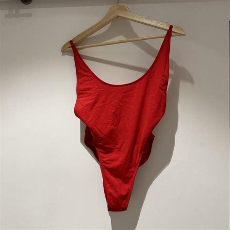 Lioness, red one piece swimsuit with a high cut leg... - Depop