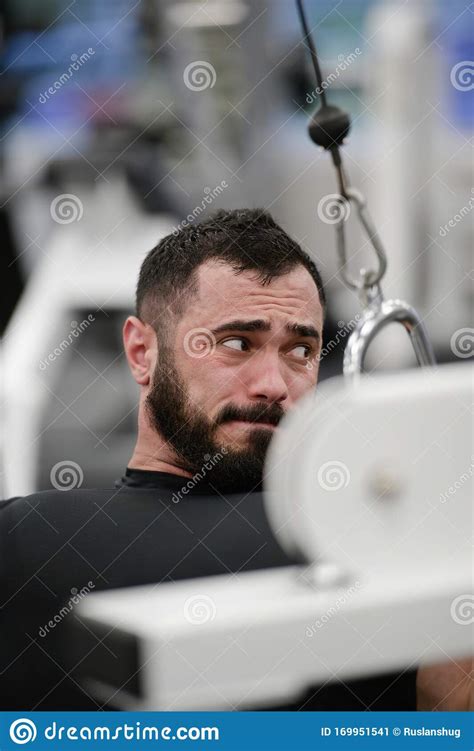 Strong Bearded Man In Black Jersey Lifting Heavy Weight On Exercise ...