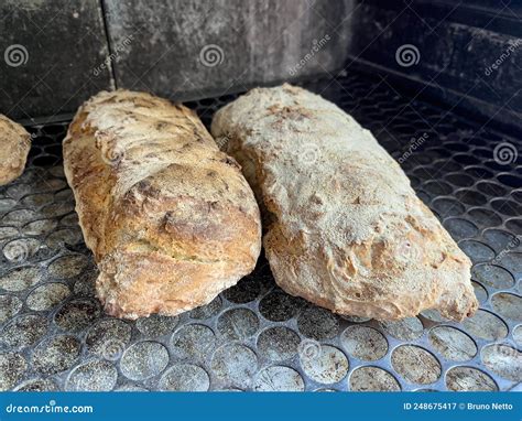 Baking Artisanal Italian Bread in the Coal Oven. Toasted Breads Ready ...