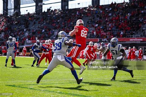 Ethan Wolf of the DC Defenders scores a touchdown in front of Chris ...