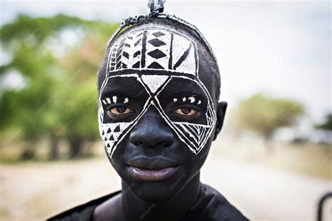 Premium Photo | Young masai warriors with traditional black and white ...