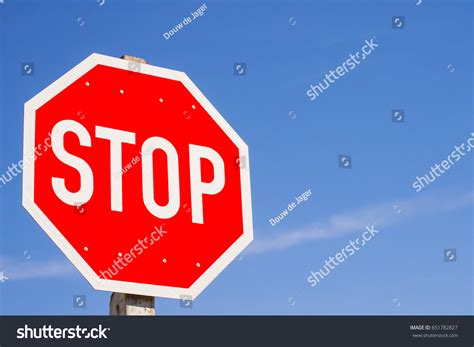 Octagon Shape Stop Sign Against Blue Stock Photo 651782827 | Shutterstock