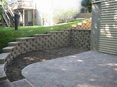 i block pavers for outdoors retaining wall with caps and a paver patio installed in i block pavers for outdoors retaining wall with caps and a paver patio installed in