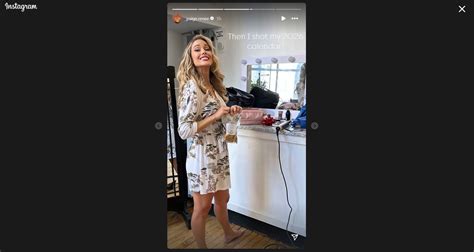Paige Spiranac rocks a white floral robe as she gets done with her ...