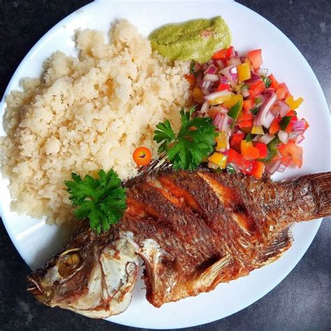 Delicious West African Food: Fish, Rice, and Veggies