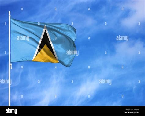 National flag of Saint Lucia on a flagpole Stock Photo - Alamy