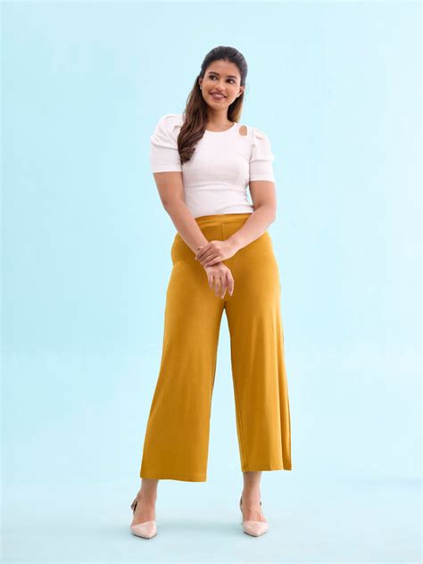 Women Solid Mustard Viscose Mid Rise Knit Palazzos