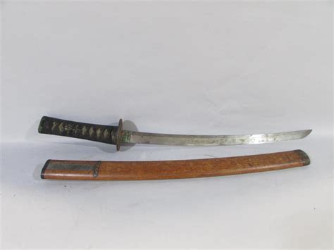 A Japanese short sword (Wakizashi) the grip with shagreen and over ...