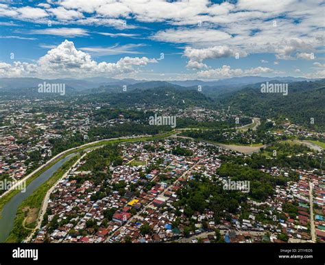 Iligan City with residential area and commercial building. Northern ...