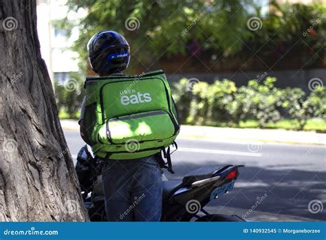 Uber Eats Driver Working at Food Delivery Service Editorial Image ...