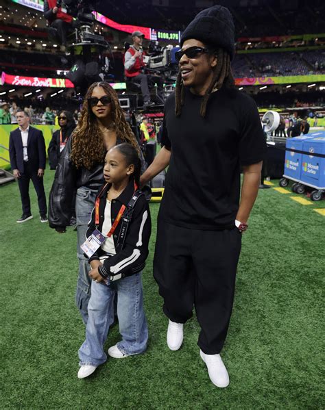 Beyonce and Jay-Z's rarely-seen daughter Rumi, 7, cheers as she joins ...