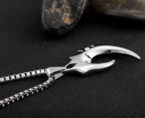 Elegant Swirl Claw Pendant with Gemstone
