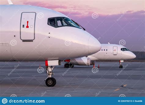 Front Parts of Modern Passenger Aircrafts on the Morning Apron of the ...