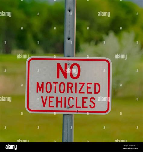 Square frame Close up view of a Winding Road Ahead sign and No ...