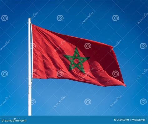 Moroccan Flag, Red with a Green Pentagram, Fluttering Vividly Against a Deep Blue Sky Stock ...