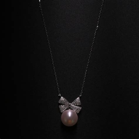 Stylish Silver Bow Pendant with Chain | The Velvet Box