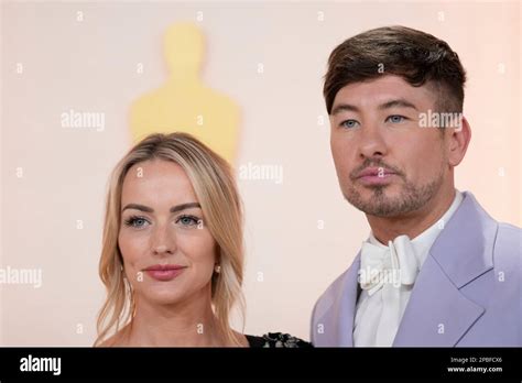 Alyson Kierans, left, and Barry Keoghan arrive at the Oscars on Sunday ...