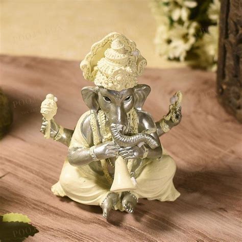 Buy Handmade Ganesha Statue with Shehnai Online in India - Mypoojabox.in
