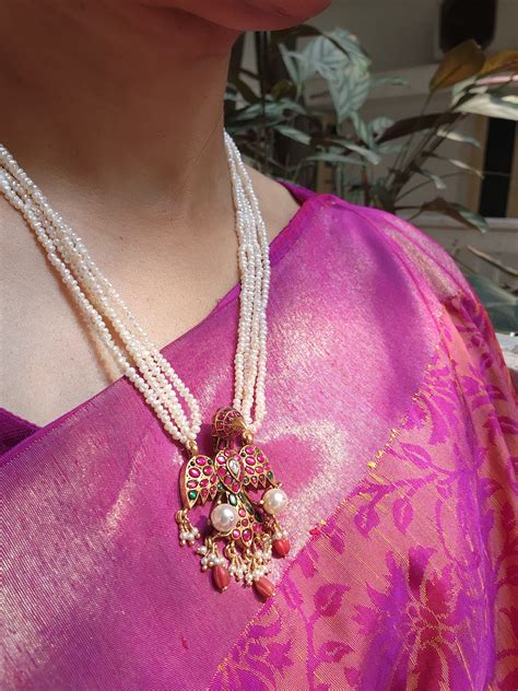 Gandeberunda kundan style pendant with pearls necklace | House of Taamara