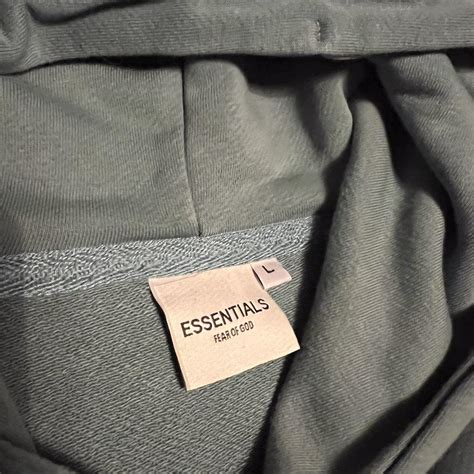 Essentials Hoodie Size L Green/mint colour Size... - Depop