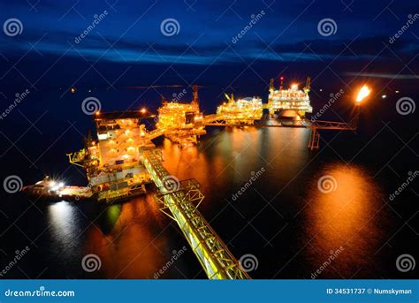 The Supply Boat is Working at Large Offshore Oil Rig at Night Stock Image - Image of twilight ...