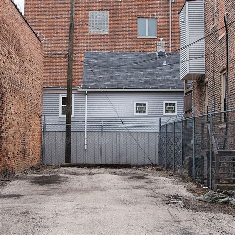 "Layers Of Walls In An Urban Neighborhood" by Stocksy Contributor "Margaret Vincent" - Stocksy