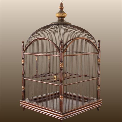 Offered is a large, hanging antique mahogany birdcage with its original ...