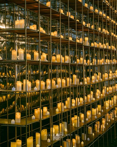 A I S L E P R O J E C T | A symphony of soft candlelight dances upon a ...