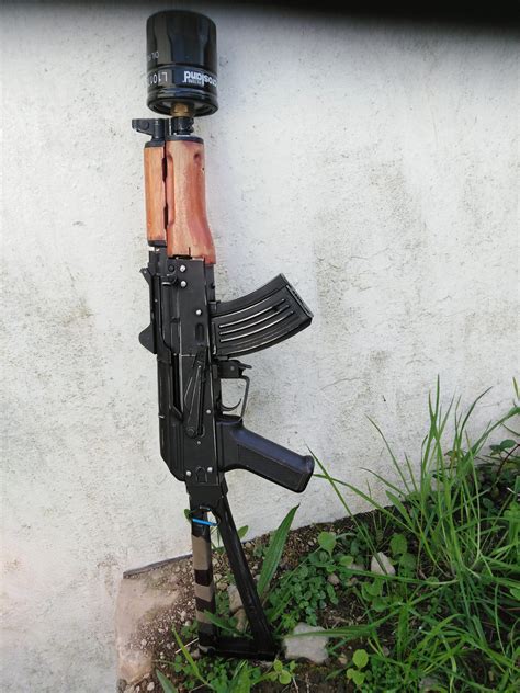 My post apocalyptic AK, complete with oil can suppressor. Needs more ...