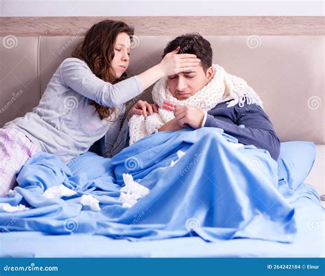 Wife Caring for Sick Husband at Home in Bed Stock Photo - Image of ...