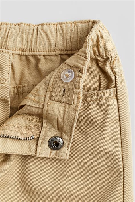 Relaxed Tapered Fit Trousers - Beige - Kids | H&M IN