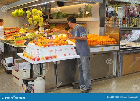 Worker at the Market with Oranges and Fresh Fruit Juices, a Specialty ...