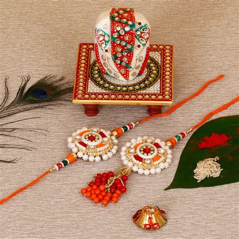 Designer Bhaiya Bhabhi Rakhi with Lord Ganesha on Kundan Studded Marble ...