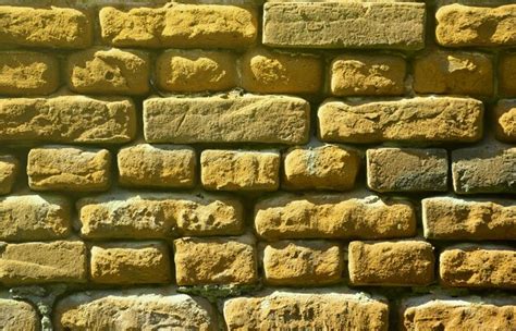 Horizontal wall texture of several rows of very old brickwork made of ...