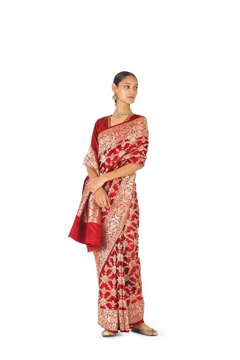 Esha Gupta, draped in a red Benarasi sari, is a homage to the Indian ...