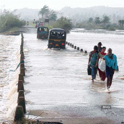 Villagers wade through flooded road after cyclone strike at Gopalpur ...