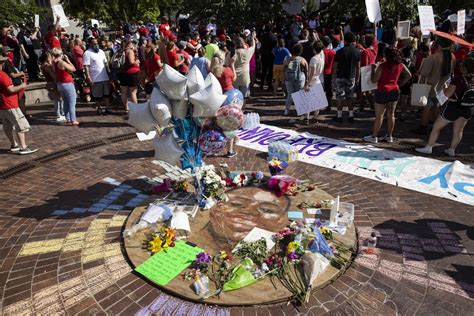 People gather at Breonna Taylors make shift memorial in Injustice Square Park in downtown Louisville