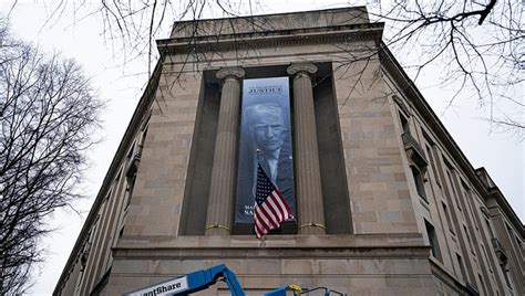 Banner featuring Trump displayed on DOJ headquarters | FOX 13 Tampa Bay