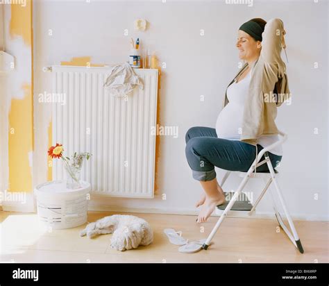 Pregnant woman nesting Stock Photo - Alamy