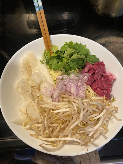 Beef and honeycomb tripe pho with homemade broth (this is before I ...
