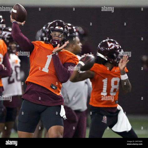 Virginia Tech quarterbacks Kyron Drones (1) and William "Pop" Watson ...