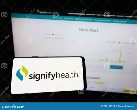 Person Holding Mobile Phone with Logo of American Healthcare Company ...