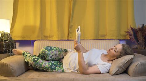 Man reading a book while lying down. 33547172 Stock Video at Vecteezy