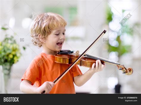 Child Playing Violin. Image & Photo (Free Trial) | Bigstock