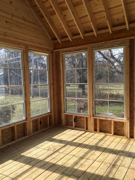 Sunroom with Wood Flooring Walls